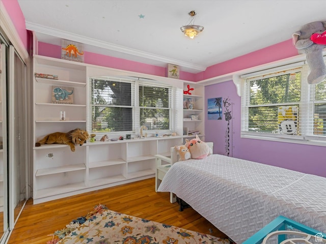 1815 E Hillcrest Ave, Salt Lake City, UT 84106 - bedroom featuring wood finished floors, crown molding, and a closet