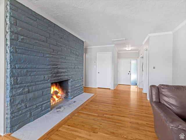 1815 E Hillcrest Ave, Salt Lake City, UT 84106 - living area with light wood-type flooring, crown molding, a fireplace, and a textured ceiling