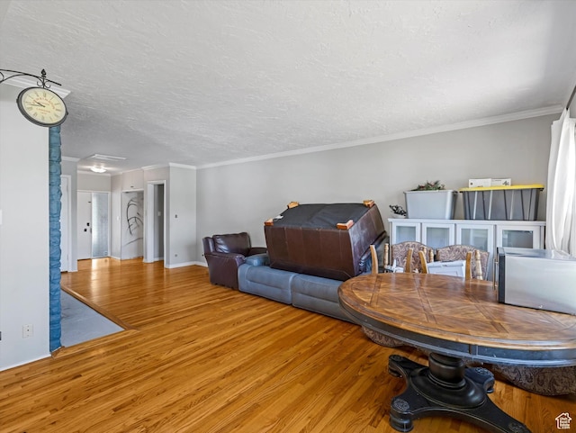 1815 E Hillcrest Ave, Salt Lake City, UT 84106 - living room with wood finished floors, ornamental molding, and a textured ceiling