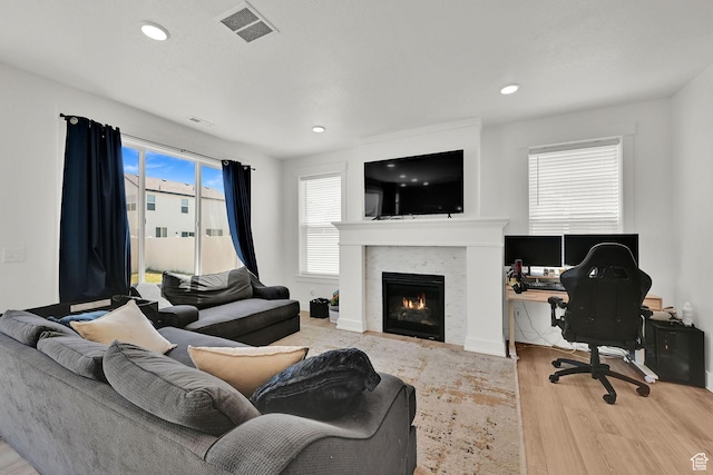 892 N 900 W, Tremonton, UT 84337 - living area with wood finished floors, a warm lit fireplace, a desk, and recessed lighting