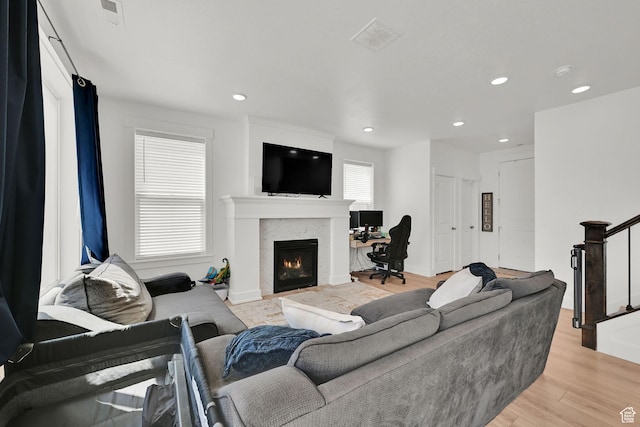 892 N 900 W, Tremonton, UT 84337 - living room with a lit fireplace, light wood-style floors, and recessed lighting