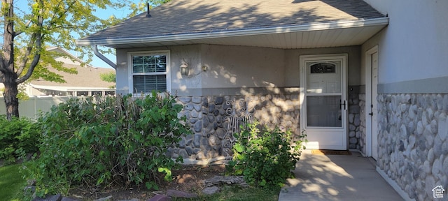 51 N 370 E, American Fork, UT 84003 - view of exterior entry with stone siding, a shingled roof, and stucco siding