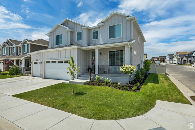10948 S Samoa Dune Dr Unit 1027, South Jordan, UT 84009 - view of front of property featuring board and batten siding, a porch, a garage, and a residential view