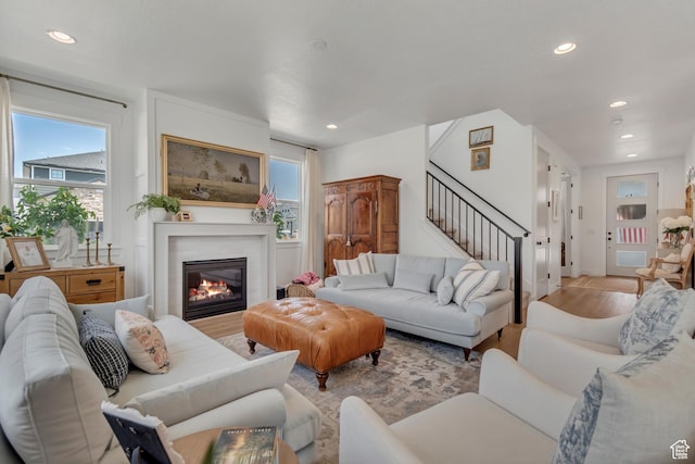 10948 S Samoa Dune Dr Unit 1027, South Jordan, UT 84009 - living room with recessed lighting, light wood-type flooring, stairway, plenty of natural light, and a glass covered fireplace