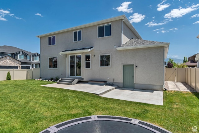 10948 S Samoa Dune Dr Unit 1027, South Jordan, UT 84009 - rear view of house featuring stucco siding, a fenced backyard, a patio area, and a gate