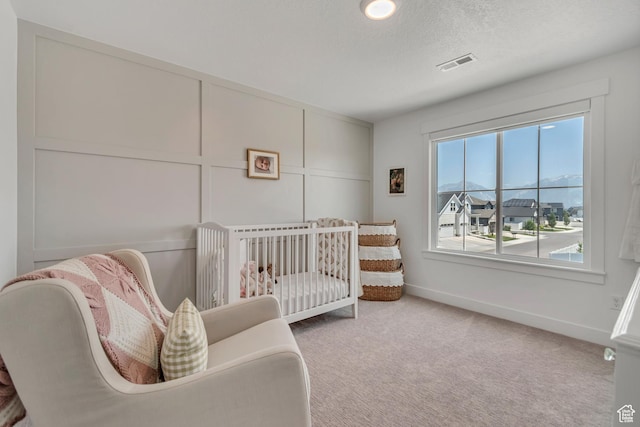 10948 S Samoa Dune Dr Unit 1027, South Jordan, UT 84009 - bedroom with carpet flooring and a crib