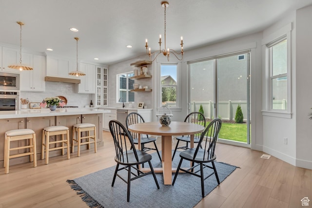 10948 S Samoa Dune Dr Unit 1027, South Jordan, UT 84009 - dining space featuring healthy amount of natural light, light wood-style flooring, and recessed lighting