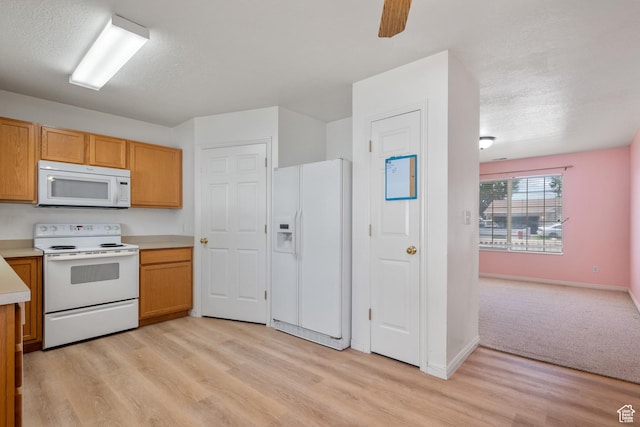 1520 W 300 S, Lehi, UT 84043 - kitchen featuring white appliances, light wood-style flooring, light countertops, a textured ceiling, and ceiling fan