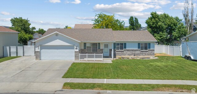 1520 W 300 S, Lehi, UT 84043 - single story home with a garage, a porch, concrete driveway, and brick siding
