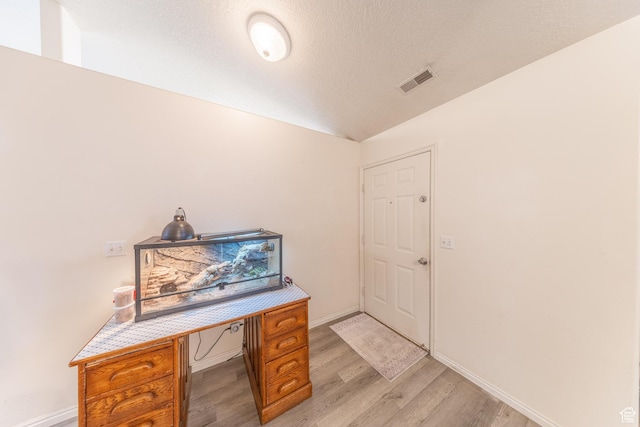 3762 W 4700 S, Roy, UT 84067 - office space with light wood-style floors, lofted ceiling, and a textured ceiling