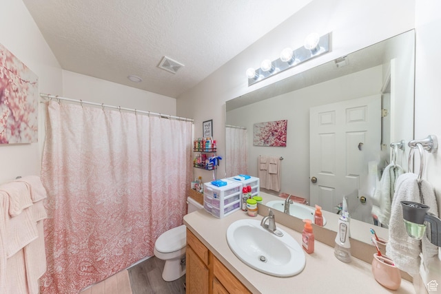 3762 W 4700 S, Roy, UT 84067 - full bath with vanity, wood finished floors, a textured ceiling, and a shower with shower curtain