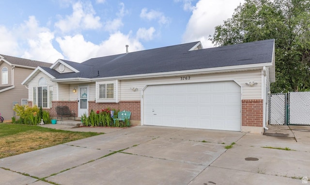 3762 W 4700 S, Roy, UT 84067 - ranch-style house featuring brick siding, driveway, and an attached garage