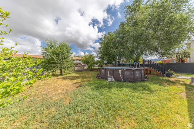 3762 W 4700 S, Roy, UT 84067 - fenced backyard featuring an outdoor pool, stairs, and a deck