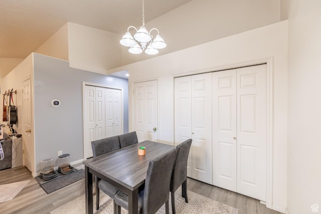 3762 W 4700 S, Roy, UT 84067 - dining space with a chandelier, light wood-type flooring, and lofted ceiling