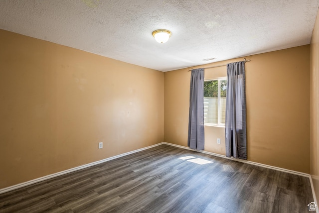 494 W 600 S, Tooele, UT 84074 - empty room with dark wood-type flooring and a textured ceiling