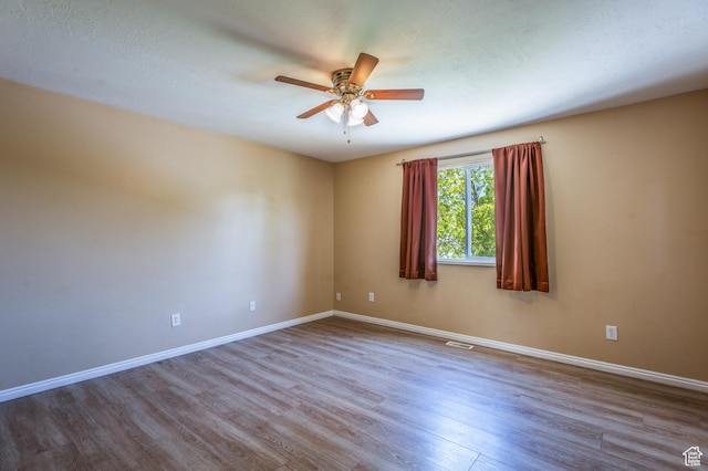 494 W 600 S, Tooele, UT 84074 - empty room with wood finished floors and a ceiling fan
