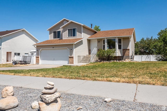 494 W 600 S, Tooele, UT 84074 - tri-level home with a garage, driveway, and a shingled roof