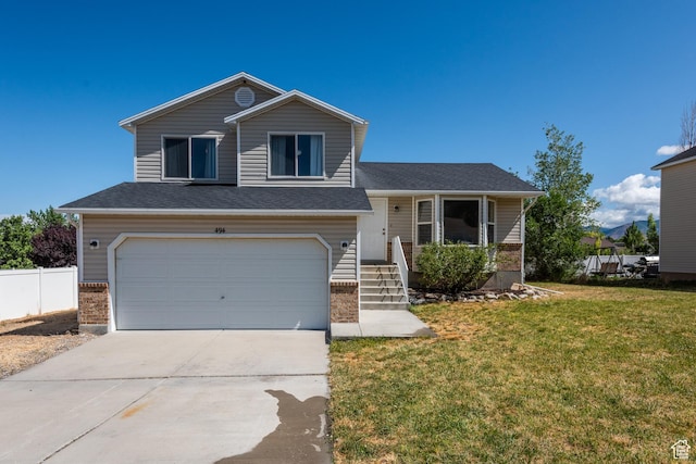 494 W 600 S, Tooele, UT 84074 - split level home featuring a garage and concrete driveway