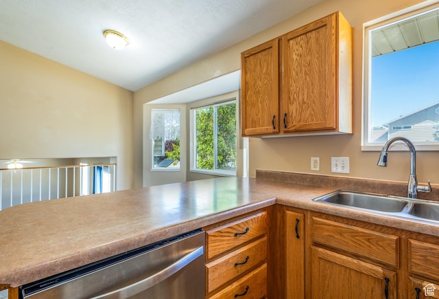 494 W 600 S, Tooele, UT 84074 - kitchen featuring stainless steel dishwasher, brown cabinetry, and a peninsula