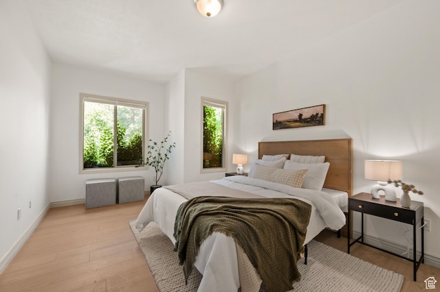 5155 S Alvera Dr E, Holladay, UT 84117 - bedroom with multiple windows and light wood-style floors