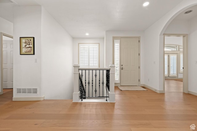 5155 S Alvera Dr E, Holladay, UT 84117 - entryway featuring arched walkways, wood finished floors, and recessed lighting