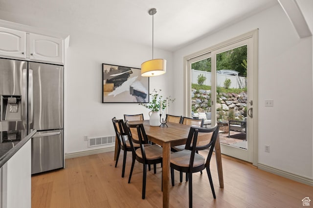 5155 S Alvera Dr E, Holladay, UT 84117 - dining area featuring light wood finished floors and arched walkways