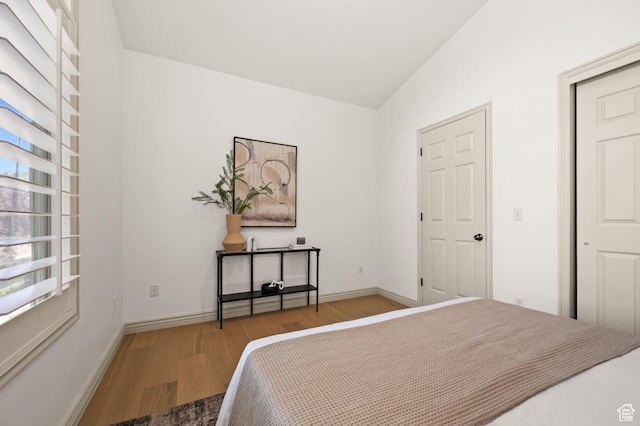 5155 S Alvera Dr E, Holladay, UT 84117 - bedroom featuring wood finished floors and vaulted ceiling