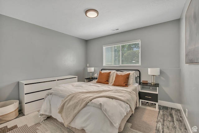 4851 S Woodbridge Dr Unit 38, Holladay, UT 84117 - bedroom with light wood-style floors and baseboards