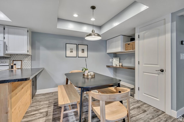 4851 S Woodbridge Dr Unit 38, Holladay, UT 84117 - dining room with a raised ceiling, light wood-style floors, and recessed lighting