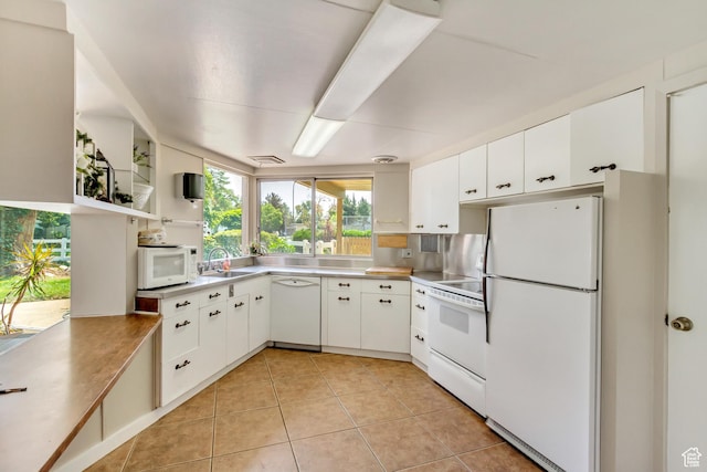 4851 S Woodbridge Dr Unit 38, Holladay, UT 84117 - kitchen featuring white appliances, light tile patterned floors, white cabinets, and light countertops