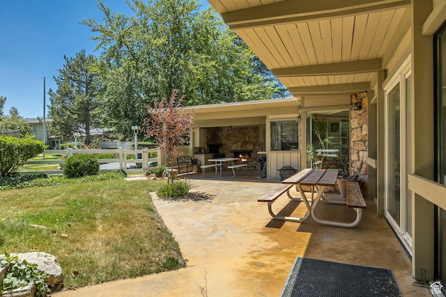 4851 S Woodbridge Dr Unit 38, Holladay, UT 84117 - view of patio / terrace with a lit fireplace
