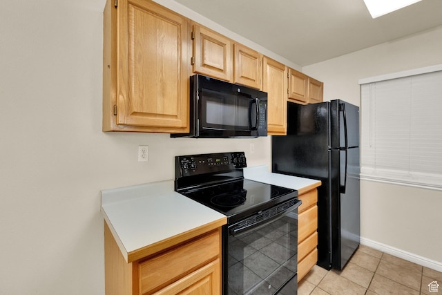 650 S Main St Unit 7103, Bountiful, UT 84010 - kitchen featuring black appliances, light brown cabinets, light countertops, and light tile patterned floors