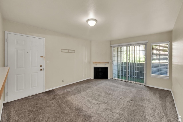 650 S Main St Unit 7103, Bountiful, UT 84010 - unfurnished living room with carpet floors and a fireplace