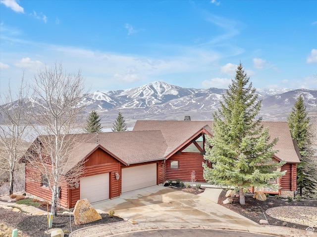 12069 N Sage Hollow Cir, Heber City, UT 84032 - log home with an attached garage, a mountain view, and driveway