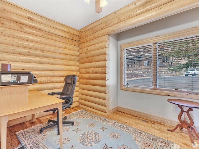 12069 N Sage Hollow Cir, Heber City, UT 84032 - office space featuring wood finished floors, rustic walls, and a ceiling fan