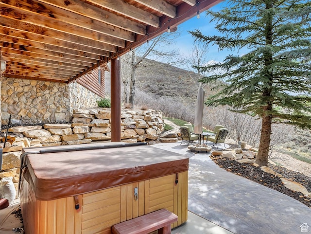 12069 N Sage Hollow Cir, Heber City, UT 84032 - view of patio / terrace with a hot tub and a mountain view