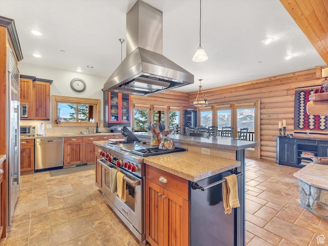 12069 N Sage Hollow Cir, Heber City, UT 84032 - kitchen featuring island exhaust hood, stainless steel appliances, log walls, a kitchen island, and stone tile floors