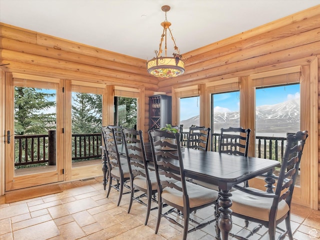 12069 N Sage Hollow Cir, Heber City, UT 84032 - dining space with stone tile flooring and log walls