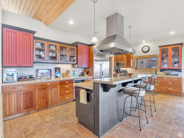 12069 N Sage Hollow Cir, Heber City, UT 84032 - kitchen featuring exhaust hood, built in appliances, stone tile floors, tasteful backsplash, and recessed lighting