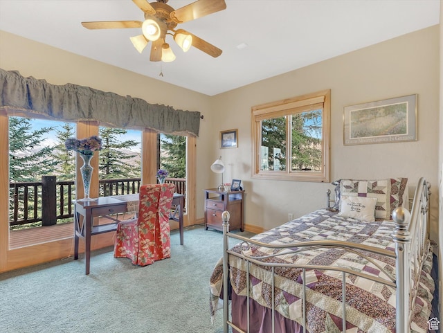 12069 N Sage Hollow Cir, Heber City, UT 84032 - carpeted bedroom featuring multiple windows, access to exterior, and a ceiling fan