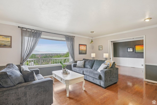 1174 Oakmont Ln, Provo, UT 84604 - living area featuring wood finished floors and ornamental molding