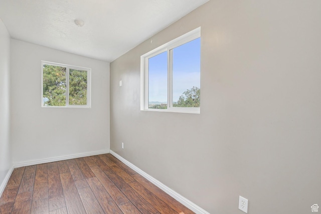 1174 Oakmont Ln, Provo, UT 84604 - spare room with baseboards and dark wood-type flooring