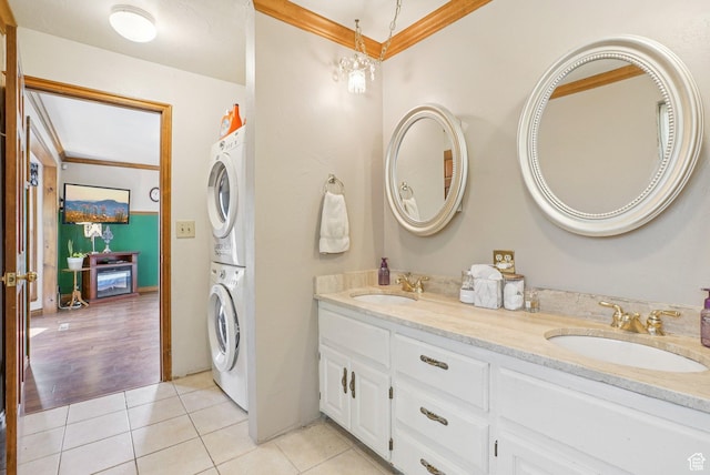 1174 Oakmont Ln, Provo, UT 84604 - bathroom with ornamental molding, stacked washer / drying machine, double vanity, and tile patterned floors