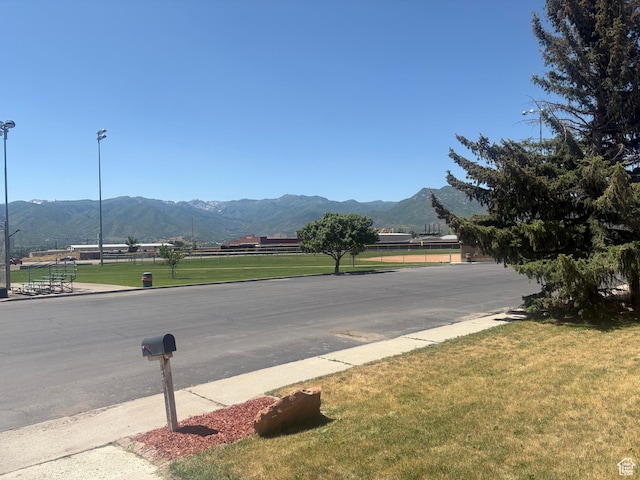 585 S 600 W, Heber City, UT 84032 - view of asphalt road featuring a mountain view, street lighting, and curbs