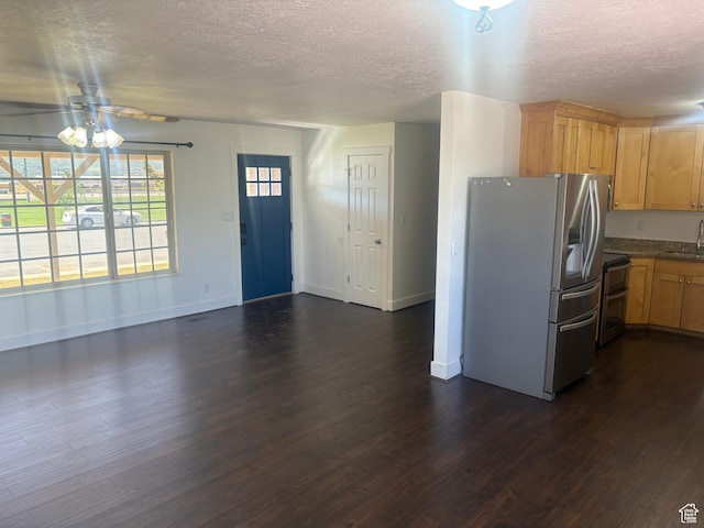 585 S 600 W, Heber City, UT 84032 - kitchen with stainless steel appliances, a textured ceiling, dark wood finished floors, dark countertops, and a ceiling fan