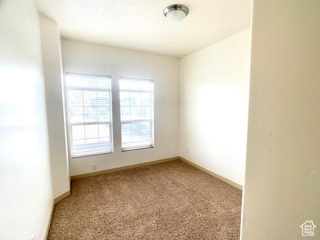 4276 S Main St W Unit 210, Murray, UT 84107 - empty room featuring light carpet and baseboards