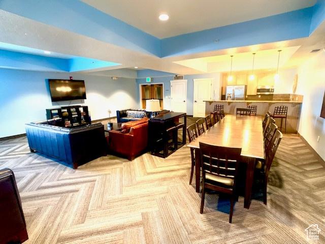 4276 S Main St W Unit 210, Murray, UT 84107 - carpeted dining area with a tray ceiling and recessed lighting