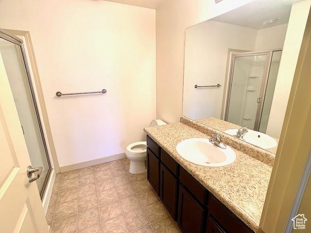 4276 S Main St W Unit 210, Murray, UT 84107 - full bath with vanity, a shower stall, and tile patterned flooring