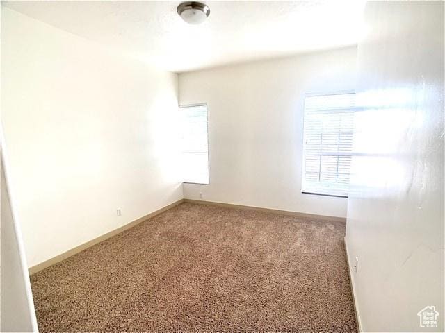 4276 S Main St W Unit 210, Murray, UT 84107 - carpeted spare room featuring baseboards