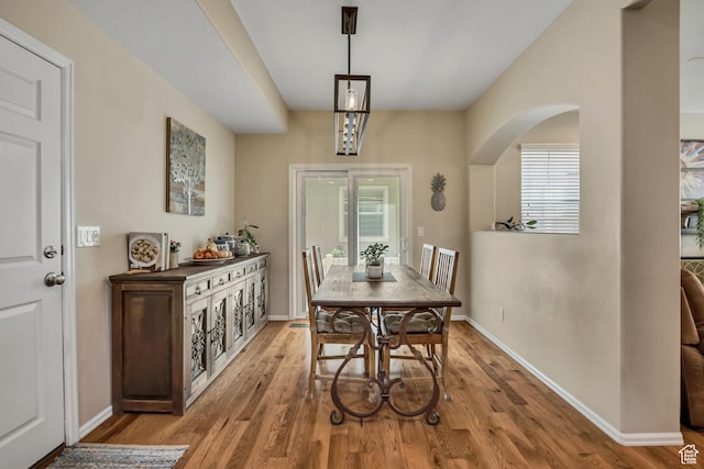 10253 S Clarks Hill Dr, South Jordan, UT 84009 - dining area featuring light wood finished floors, healthy amount of natural light, and arched walkways